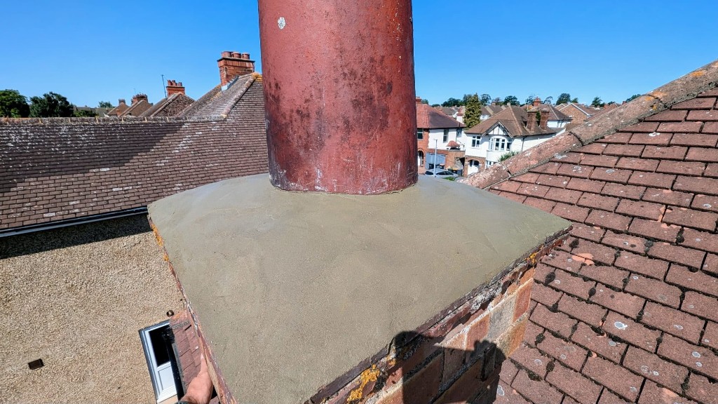 Chimney pot flaunching repair on a residential tiled roof