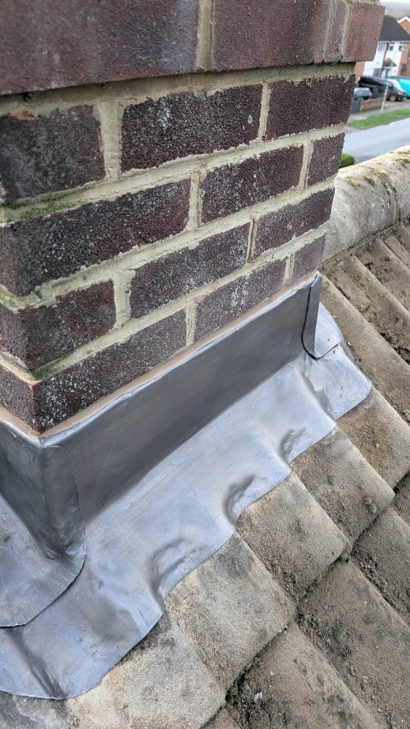 Chimney repair with lead flashing