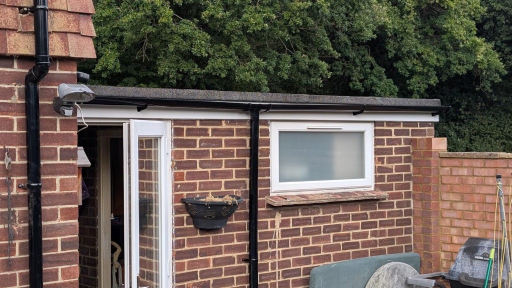 Guttering and fascia replaced on a brick outbuilding with a new flat roof
