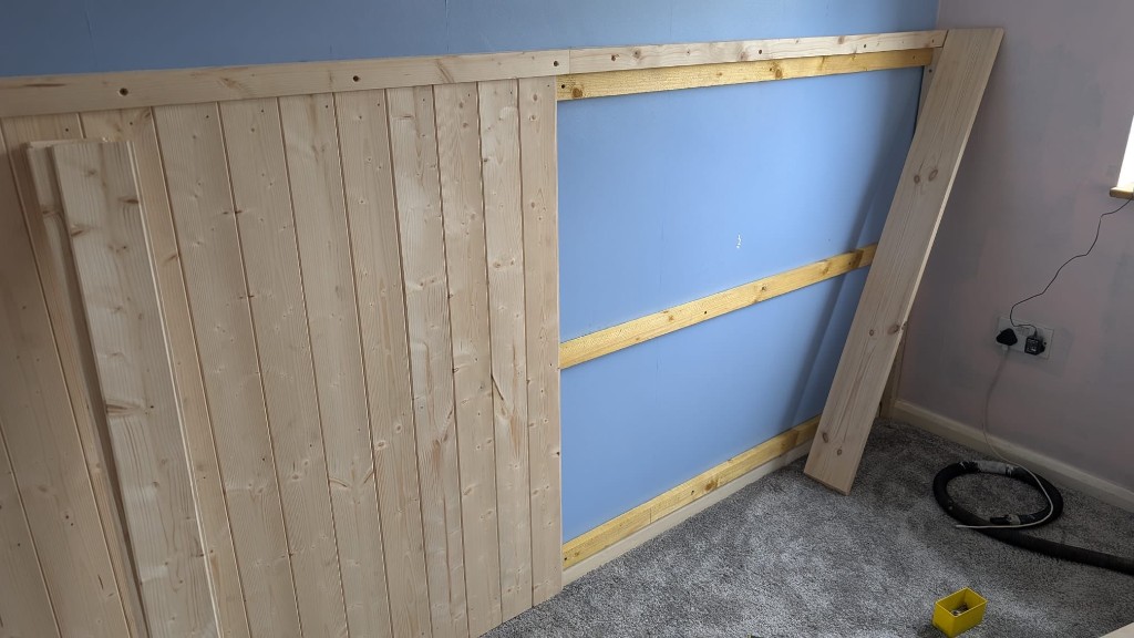 Wooden panelling custom build in progress on an interior wall