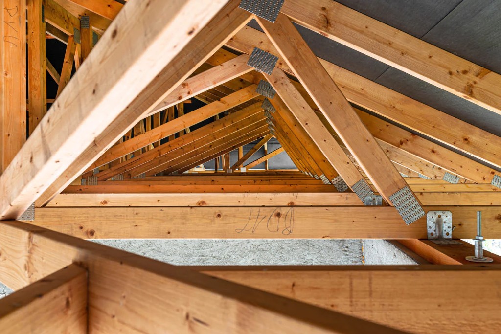 Interior view of newly installed wooden roof trusses